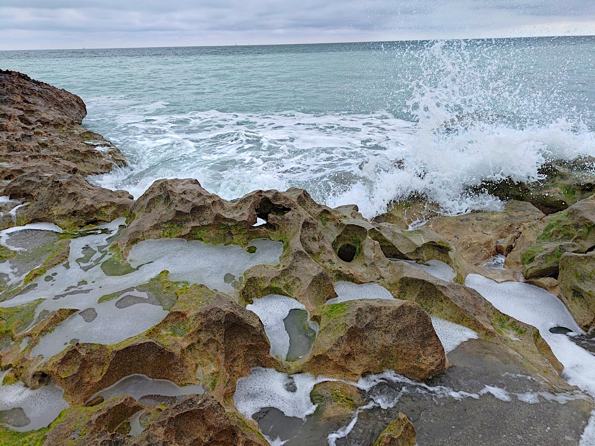 Wave Hitting Rocks with Hole