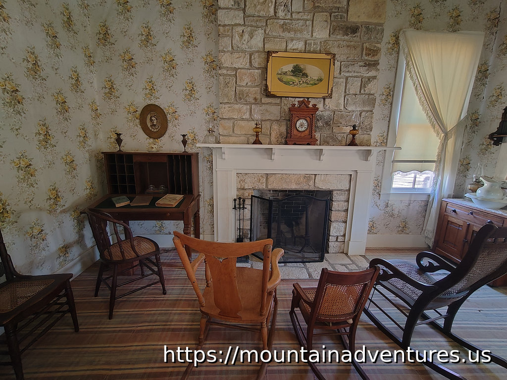 A Room with a Desk and Fireplace