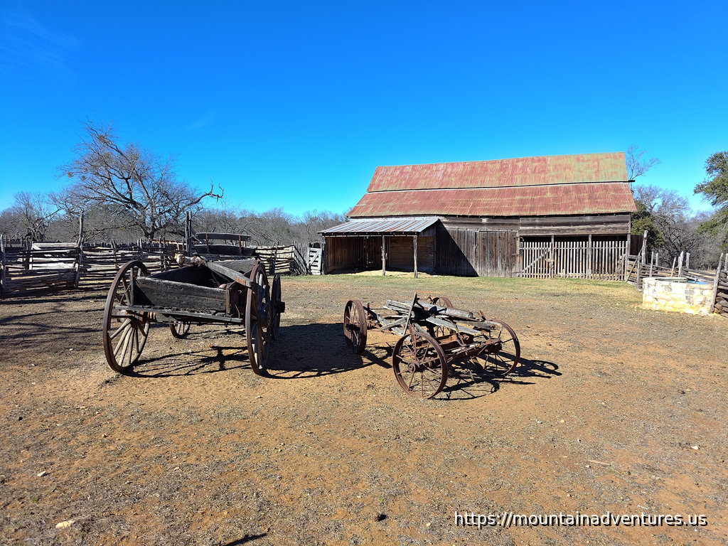 Wagons and Farm Building on the Sauer-Beckmann Living Farm in Texas
