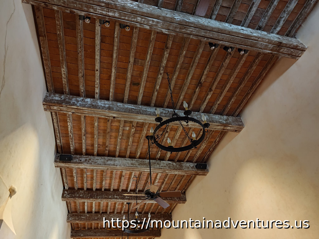 Ceiling Inside the Mission San Juan Church with a Chandelier