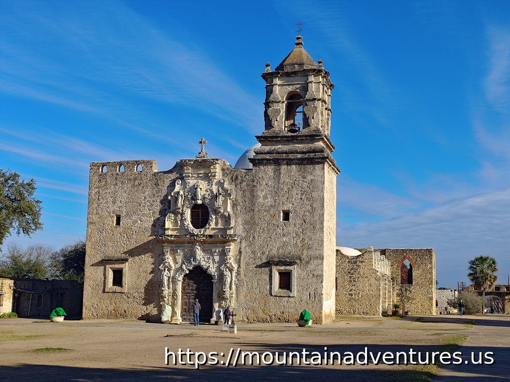 Front view of the Church with a bell tower on one side.