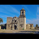 Front view of the Church with a bell tower on one side.